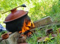 cooking curry in an earthen pot Royalty Free Stock Photo