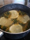 Cooking Dandelion Honey Vegan with Lemons and Flowers in Pan