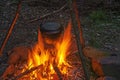 Cooking dinner in cauldron pot over an open fire Royalty Free Stock Photo