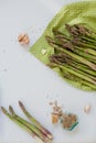 Cooking dinner. Fresh raw asparagus, garlic and smoked salt in a vintage bottle