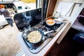 Cooking dinner or lunch in campervan, motorhome or RV
