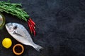 Cooking dorado fish. Black background top view copyspace Royalty Free Stock Photo