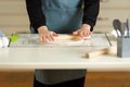 Cooking dough products on a large kitchen table on a kitchen silicone mat with copy space