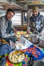 Cooking and eating view with indian drivers inside the truck