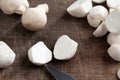 Cooking edible puffball mushrooms. Cutting peeled mushrooms on a cutting board, closeup