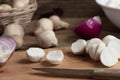 Cooking edible puffball mushrooms. Cutting peeled mushrooms on a cutting board, closeup