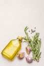 Cooking food background. Fresh rosemary, garlic clove, olive oil, black pepper Royalty Free Stock Photo