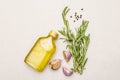 Cooking food background. Fresh rosemary, garlic clove, olive oil, black pepper Royalty Free Stock Photo