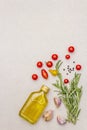 Cooking food background. Fresh rosemary, garlic clove, olive oil, black pepper Royalty Free Stock Photo