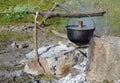 Cooking food in a bowler hat in the open air Royalty Free Stock Photo