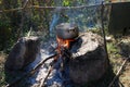 Cooking food on a campfire in a hike