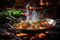 Cooking food in flaming frying pan on open fire, culinary concept with sizzling flames Royalty Free Stock Photo