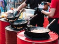 Cooking food in pans at a street festival Royalty Free Stock Photo