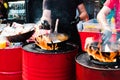 Cooking food in pans at a street festival Royalty Free Stock Photo