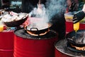 Cooking food in pans at a street festival Royalty Free Stock Photo