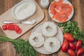 Cooking of a food with round toast with cheese, red fish, tomatoes and vegetables/Healthy food with round toast, red fish, vegetab