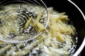 Cooking french fries in the deep fryer, Homemade french fries Royalty Free Stock Photo