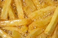 Cooking french fries in oil close-up, background. Potato frying with bubble Royalty Free Stock Photo