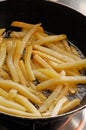 Cooking french potatoes fries.