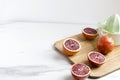 Cooking of fresh delicious blood orange juice. Manual juicer and cutting board.Empty space for your design Royalty Free Stock Photo