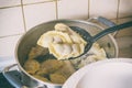 Cooking fresh dumplings with cherry filling Royalty Free Stock Photo