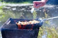 Cooking fresh fish catch. Successful fishing. Delicious fish dish fried over the fire