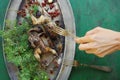 Cooking fried woodcock or snipe in hot butter with red currant. Royalty Free Stock Photo