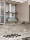 Cooking gas stove with hood in modern kitchen. Royalty Free Stock Photo