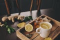 Cooking ginger, lemon and honey hot tea at home. Royalty Free Stock Photo