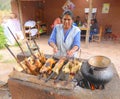 Woman cooking guinea pigs Royalty Free Stock Photo