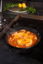 Cooking hake in cider sauce Royalty Free Stock Photo