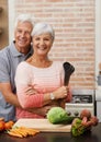 Cooking, happy and portrait of old couple in kitchen for salad, love and nutrition. Health, smile and retirement with Royalty Free Stock Photo