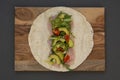 Cooking healthy avocado and vegetables burrito, wraps, rolles. Healthy breakfast or snack. Avocado sandwich. Copy space
