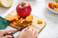 Cooking healthy diet eating Female hands are cutting fresh fruit for making summer salad Royalty Free Stock Photo