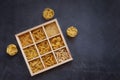 Cooking, healthy food concept. Different types of pasta in a wooden box on a dark background. View from above Royalty Free Stock Photo