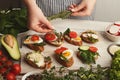 Feamale hands making healthy bruschettas for right snack Royalty Free Stock Photo