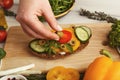 Feamale hands making healthy bruschettas for right snack Royalty Free Stock Photo