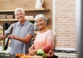 Cooking, help and portrait of old couple in kitchen for salad, love and nutrition. Happy, smile and retirement with Royalty Free Stock Photo