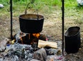 Cooking in a hike in the cauldron hanging over the fire Royalty Free Stock Photo