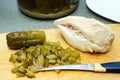 Cooking at home. Soup ingredients. Pickled cucumbers and chicken fillet Royalty Free Stock Photo