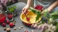 Cooking homemade cranberry pie. In the baking dish with the dough, put a spoon of fresh cranberries Royalty Free Stock Photo