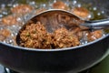 Cooking homemade INDIAN CHINESE DRY MANCHURIAN BALLS with spoon from frying Royalty Free Stock Photo