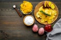 Cooking homemade potato chips with ketchup on wooden background top view copyspace Royalty Free Stock Photo