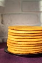 Cooking honey cake at home. Round baked cake layers stacked on a plate