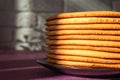 Cooking honey cake at home. Round baked cake layers stacked on a plate