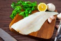 Raw atlantic cod fillet on wooden table Royalty Free Stock Photo