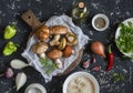 Cooking ingredients. Mushrooms,rice, vegetables and spices. On a dark background, top view. Royalty Free Stock Photo