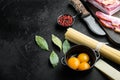 Cooking italian food collage. Ingredients for carbonara pasta, spaghetti, oil, ham, egg and parmesan, on black stone background, Royalty Free Stock Photo