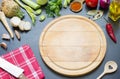 Cooking in the kitchen food background concept with spices vegetables and cutting board Royalty Free Stock Photo