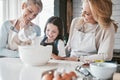 .Cooking, kitchen and grandmother with child teaching, learning and helping together for mothers day cake, cookies or Royalty Free Stock Photo